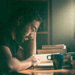 Student with some of the best MCAT prep books on his desk