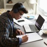 A student reviewing the Kaplan MCAT prep course