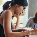 A student reading a UWorld MCAT review